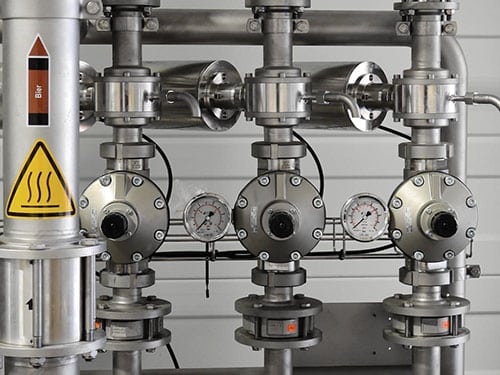 metal piping with pressure gauges
